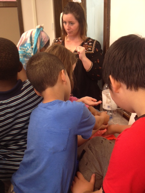 Amber Bay works with kids at Hughes Elementary School in Utica in STEM / NANO instruction.