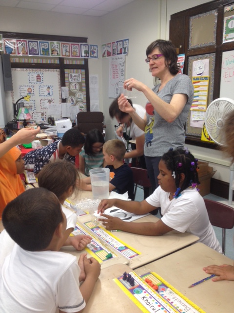 Tina Betz works with kids at Hughes Elementary School in Utica in STEM / NANO instruction.