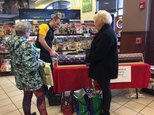 Daniel Eddy, RD & Asistant Director of Residential Life 1st Year Programs at SUNY Poly gift wraps at Barnes and Noble in New Hartford on Tuesday, December 13, 2016 to benefit Angels of Fur K-9 Rescue.