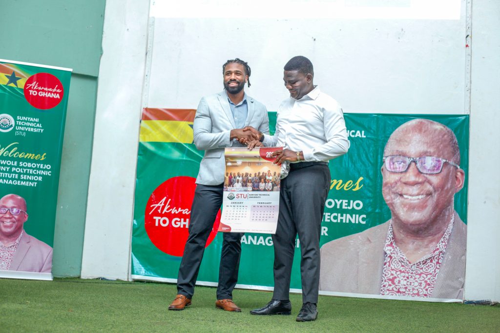 SUNY Poly's Willjavian Dawson (left) while the team was at Sunyani Technical University.