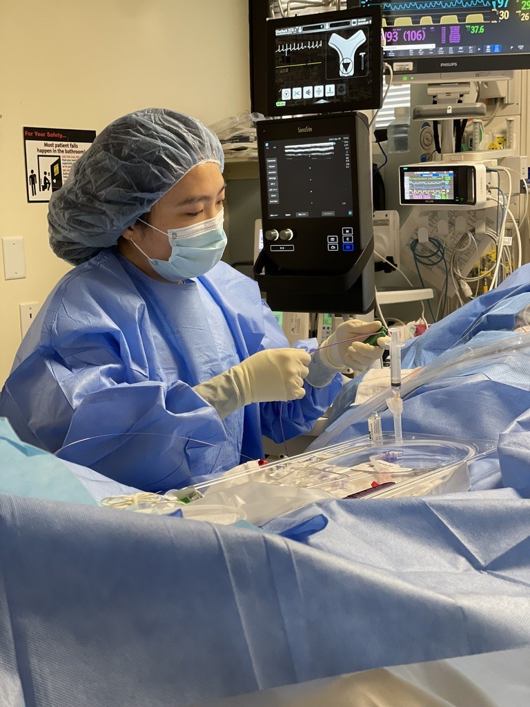 Tammy So in full nursing gear working at a hospital. 