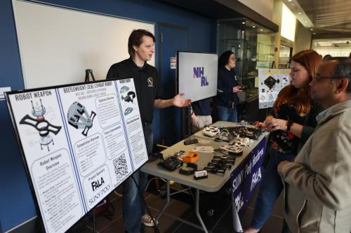 Trevor Dunn (pictured) and Haley Couch discuss their battlebot.