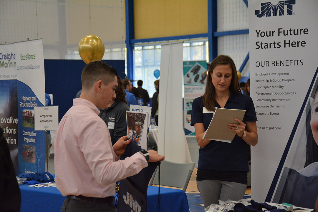 SUNY Poly student talking to a recruiter at a career fair